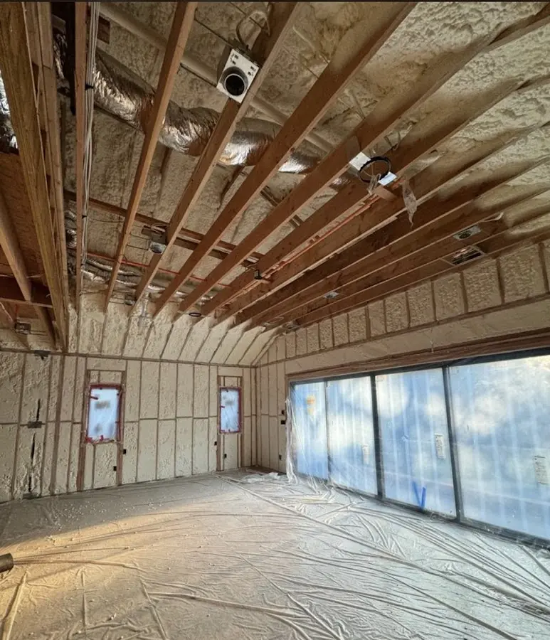 Interior walls and ceiling insulated with spray foam during new construction in Garfield